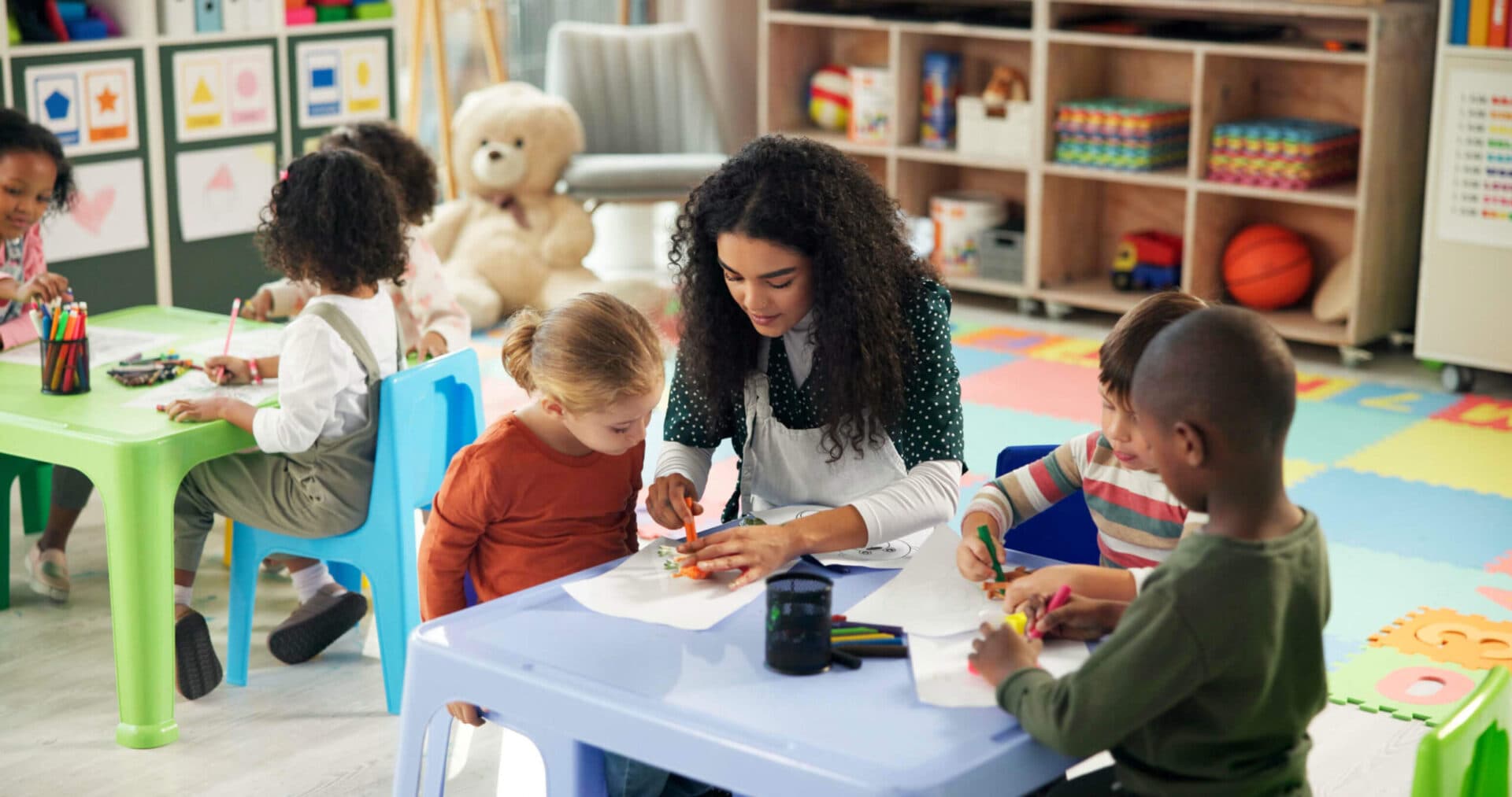 A Devine Schools teacher working with children