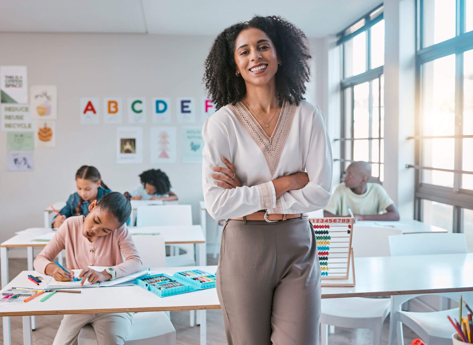 A Devine Schools teacher standing in her classroom